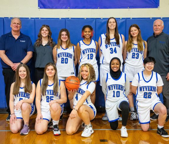 The Women's Basketball team with coaches Rich Small (left, back row) and James Griffin (right, back row)