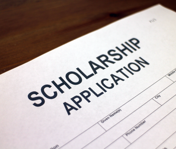 A piece of paper with the word ‘scholarship’ printed on it