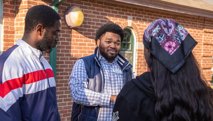Director of Mentoring and Special Programs Kalan Lewis (center) at a mentoring event