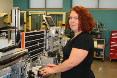 QCC student uses equipment in manufacturing lab
