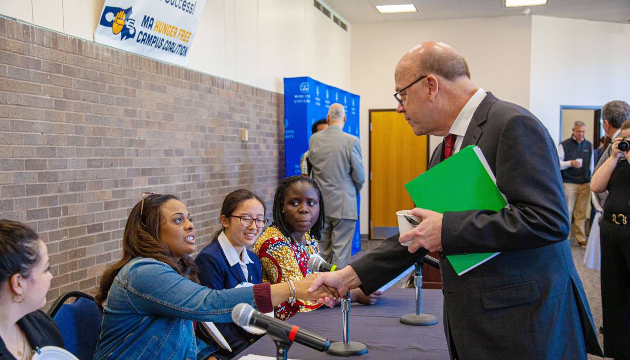 Brittany Richards shaking hands with Congressman Jim McGovern