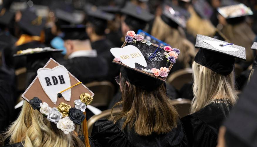 Expertly decorated mortarboard caps