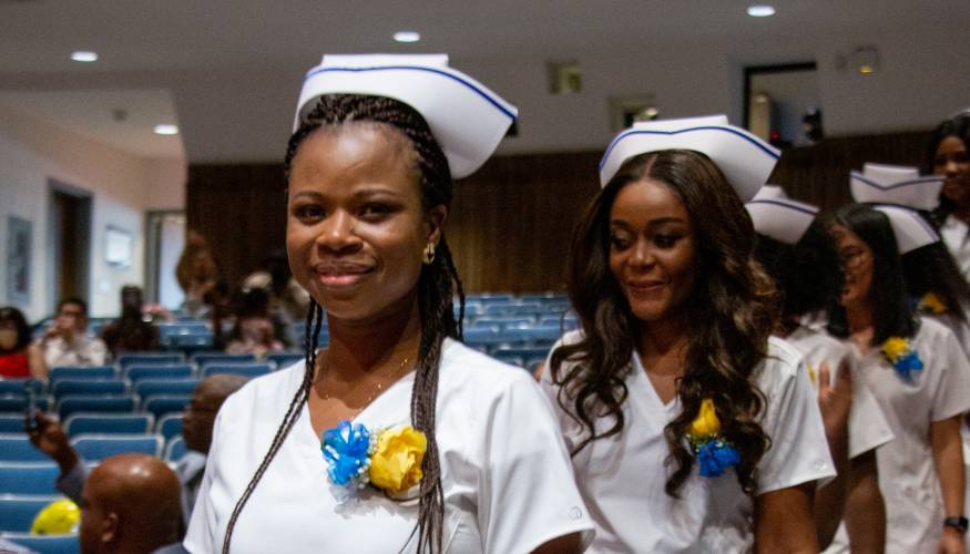 New LPNs file into the the Hebert Auditorum for their pinning ceremony.