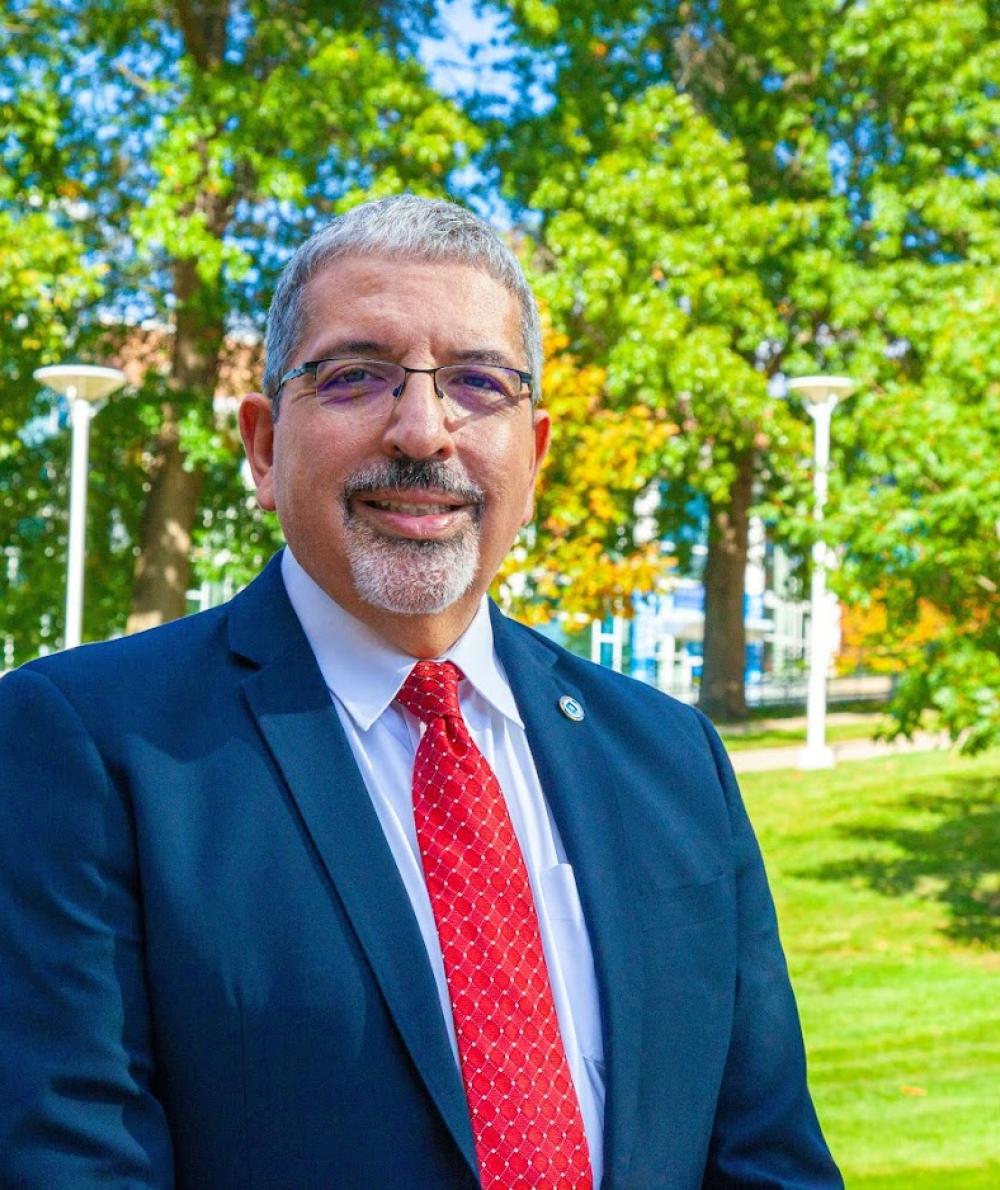 President Pedraja outside on campus