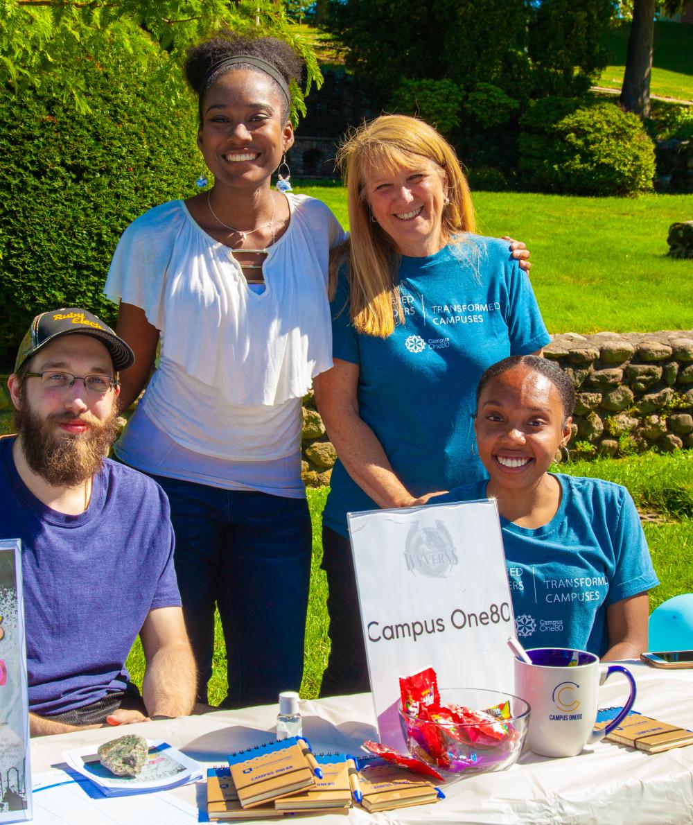 Students recruit for the Campus180 club on the Quad