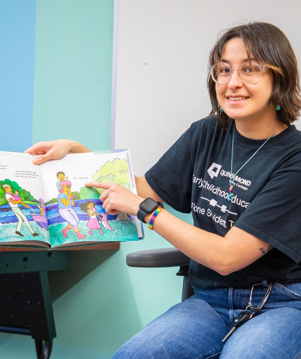 An ECE student reads a book to the class