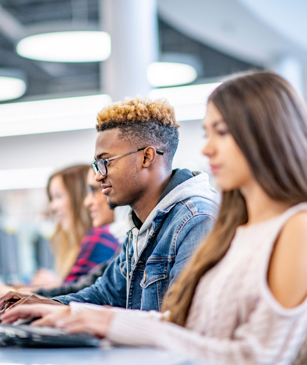 Students sit at desk and apply on the computer