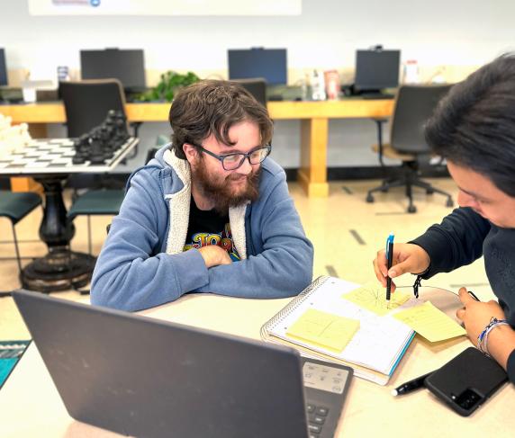 Two students study in the TRIO office