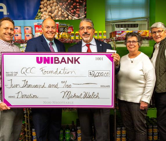 From left: QCC Foundation President Matthew E. Wally, vice president of Government & Community Affairs, UniBank; Unibank CEO Michael W. Welch; QCC President Luis G. Pedraja, Student Resources Manager Bonnie Coleman and Dean of Students Theresa Vecchio. 