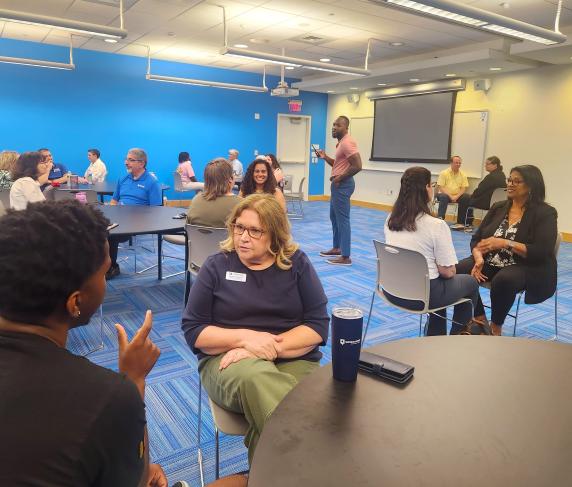 chris bijoux leads the audience through a conversation activity on Juneteenth.