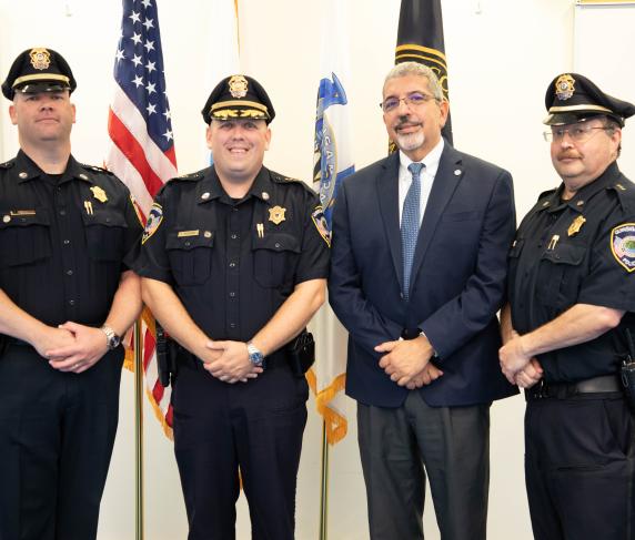 Deputy Chief of Operations Mike Vigeant, Chief of Police Stephen DiGiovanni, QCC President Dr. Luis Pedraja and Deputy Chief of Administration Reynaldo Rodriguez.
