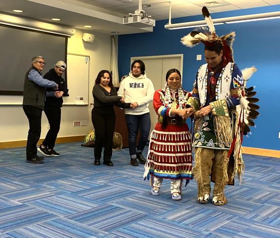 Presenters and audience members joined the alligator dance, a traditional couples dance.