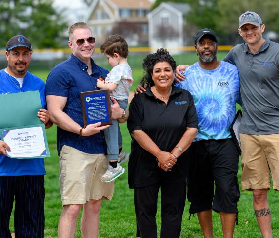(From left) Men’s Head Baseball Coach Corey Coleman, President of the Worcester Bravehearts Matt Vaccaro with son Luca, Director of Athletics & Fitness Center Lisa Gurnick, Director of Community Engagement Sean Harris and Assistant Director of Athletics & Fitness Center Josh Cole. 