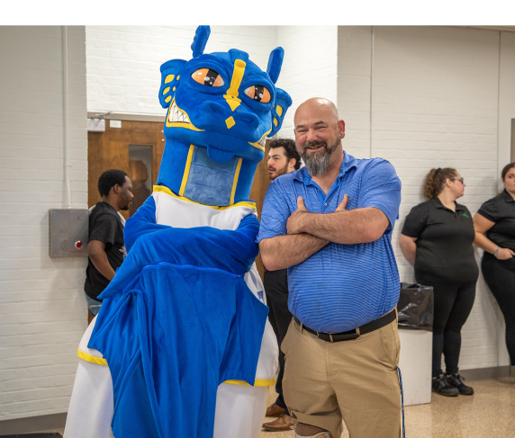 QCC student athlete Paul Landry hangs with the Wyvern at this year's athletic ceremony