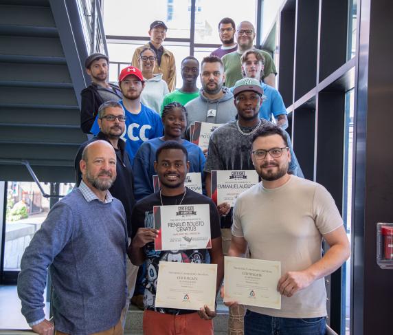 CNC certificate recipients with for-credit CNC students and Professor of Manufacturing Technology Lee Duerden (front row, left).