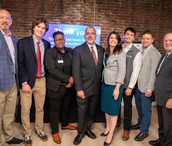 (From left) Cliff Rucker, founder of Rucker Investments and The Cliff & Susan Rucker Foundation; Noah MacDonald, QCC student; Rocky Knight, director of the Auxilium Center for Entrepreneurship at QCC; Dr. Luis Pedraja, QCC president; Stephanie Ramey, vice president of Special Projects at Rucker Investments; Jacob Rucker, co-founder of Auxilium Worcester; Zachary Dutton, executive director of Auxilium Worcester; and Tim Murray, president and CEO of Worcester Regional Chamber of Commerce 