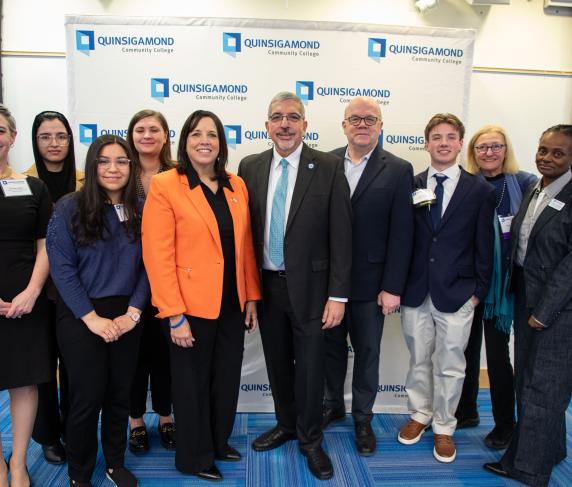 (From left) Professor of Psychology Jen Arner Welsh, student Fakhria Azimi, student Jazlyn Alas, Academic Advisor Della Burke, Massachusetts Lt. Governor Kim Driscoll, QCC President Dr. Luis Pedraja, Rep. Jim McGovern, student Ryan Heath, Board of Trustees President Dr. Linda Maykel and Vice President of Strategic Enrollment & Student Engagement Michelle Tufau.
