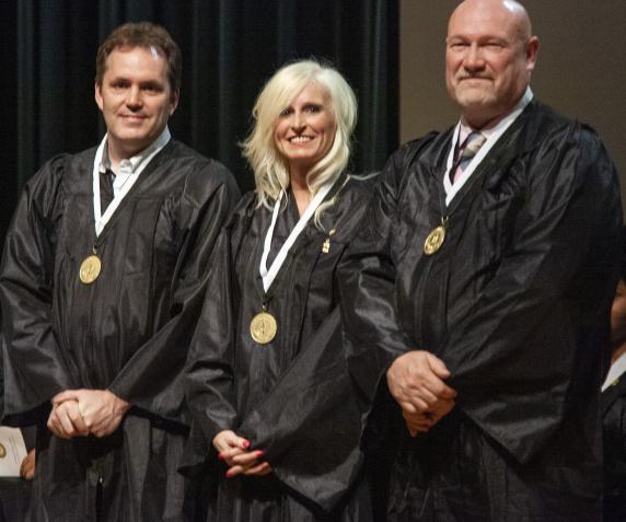 PTK graduates line up at commencement