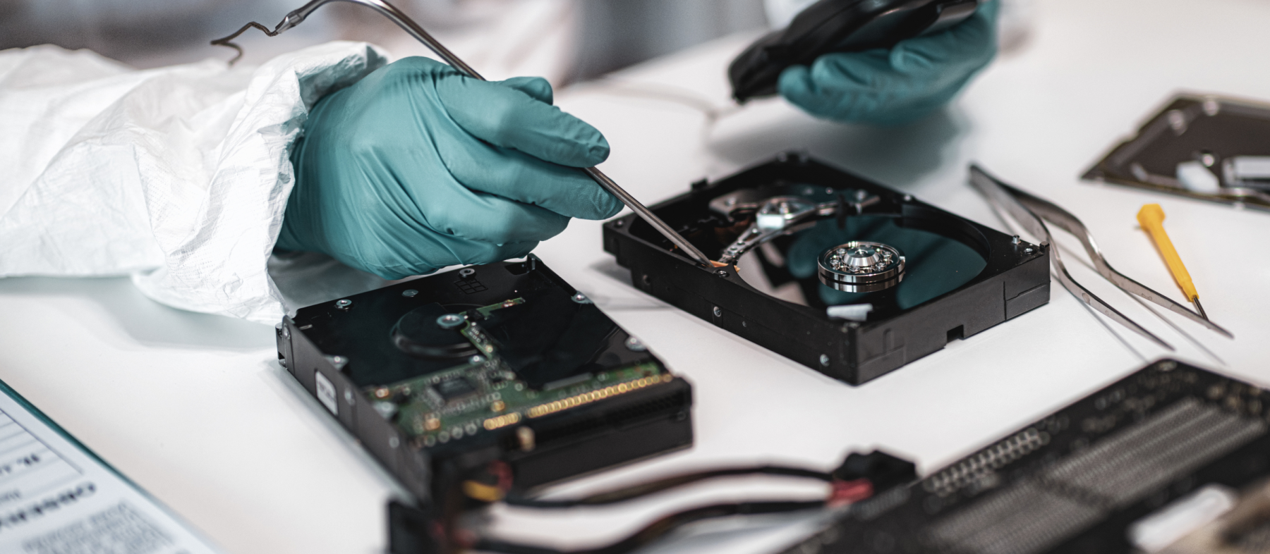 A man runs diagnostics in a lab on computer hardware