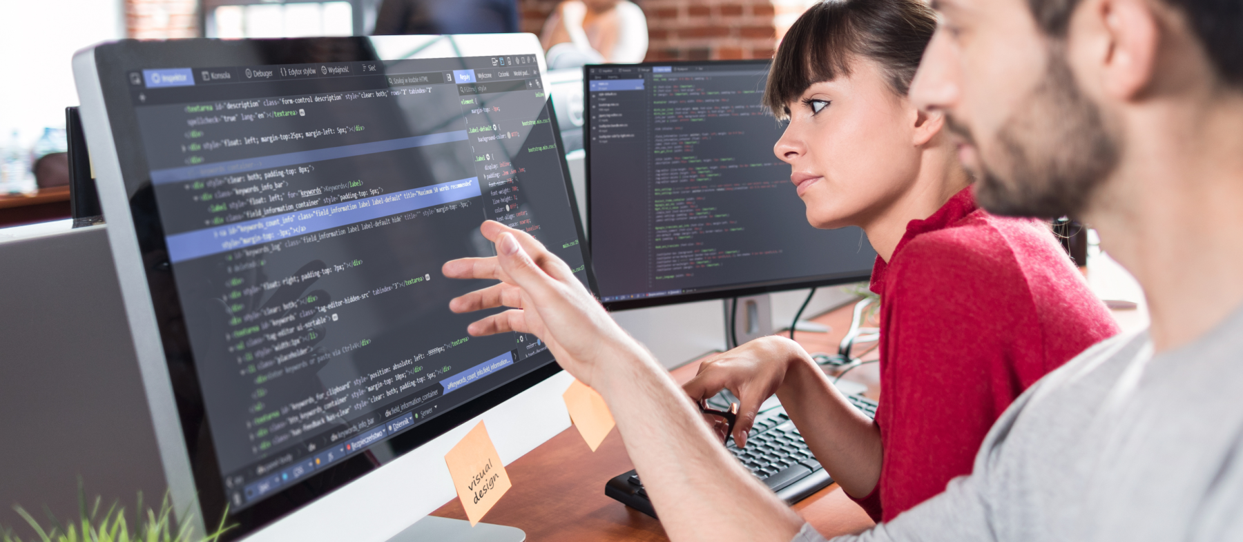 A man shows a student code on a screen