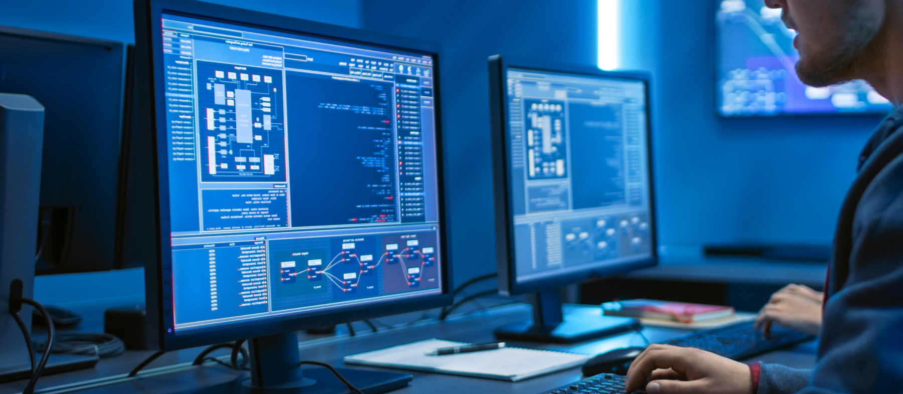 A student looks at a computer screen with complex statistics