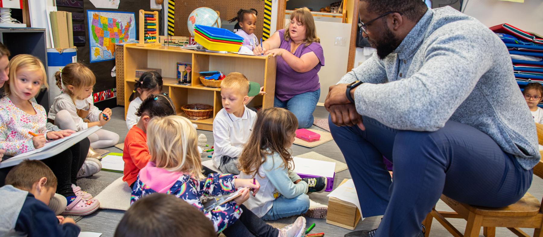 Children complete activities in the Children's School