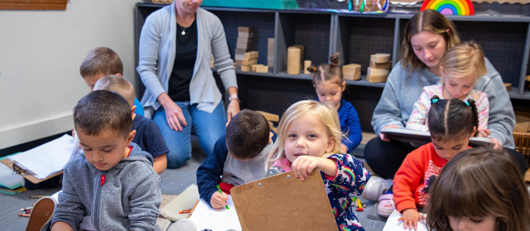 QCC students work with a class of toddlers