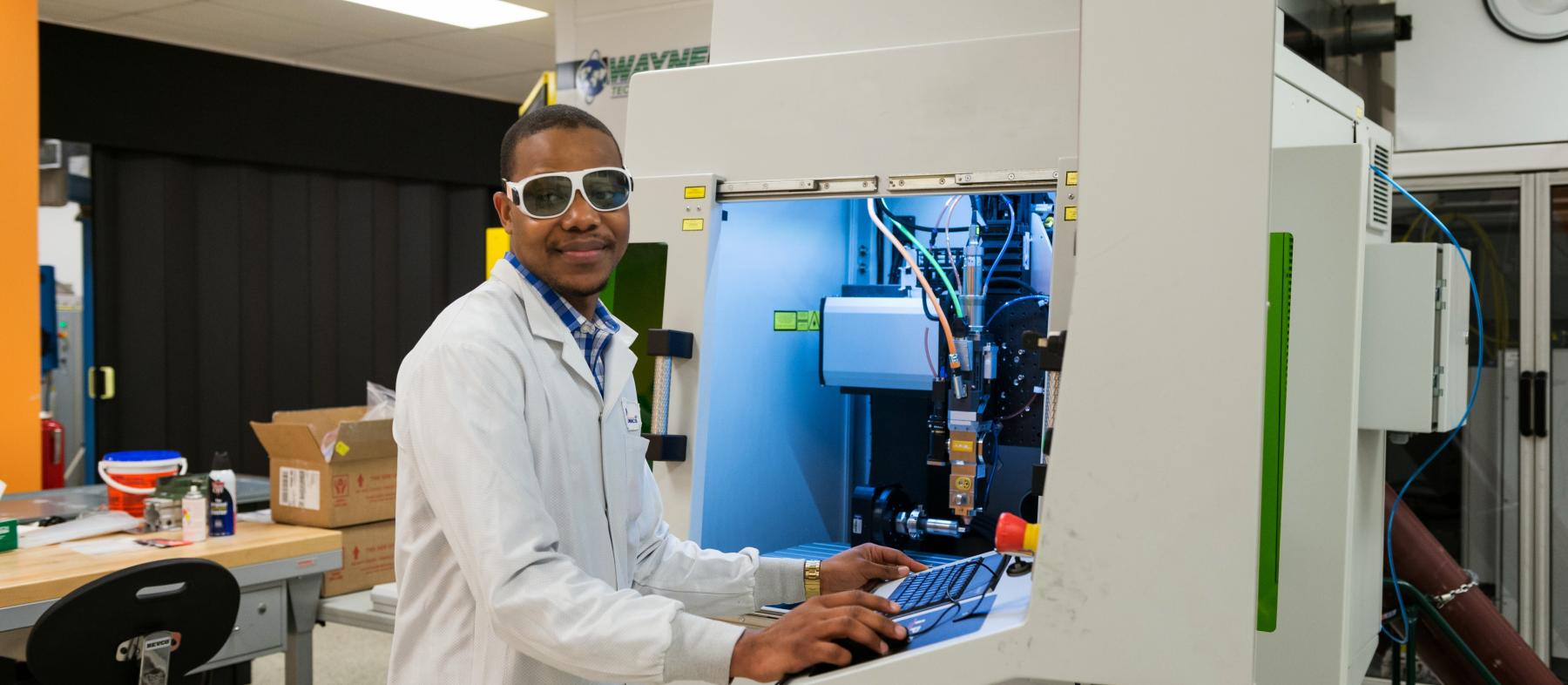 A worker at a photonics company