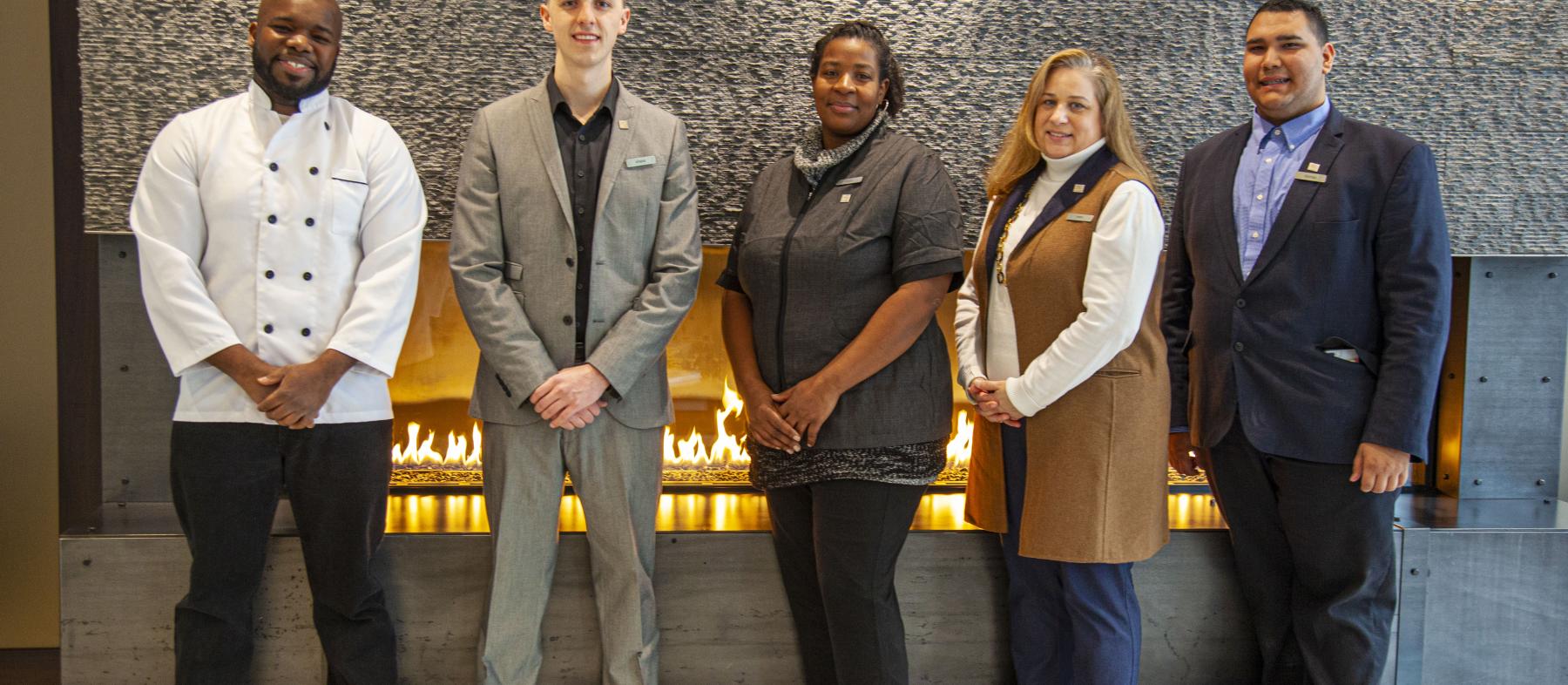 Various hotel staff in a hotel lobby