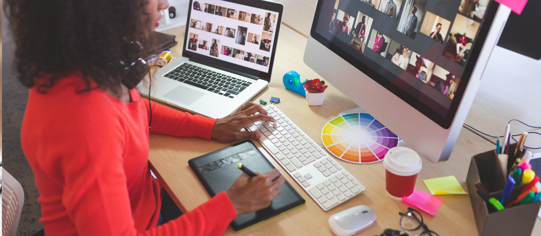 A graphic designer processes images on a computer