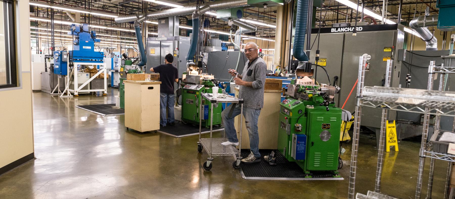 A QCC alumni works in a warehouse