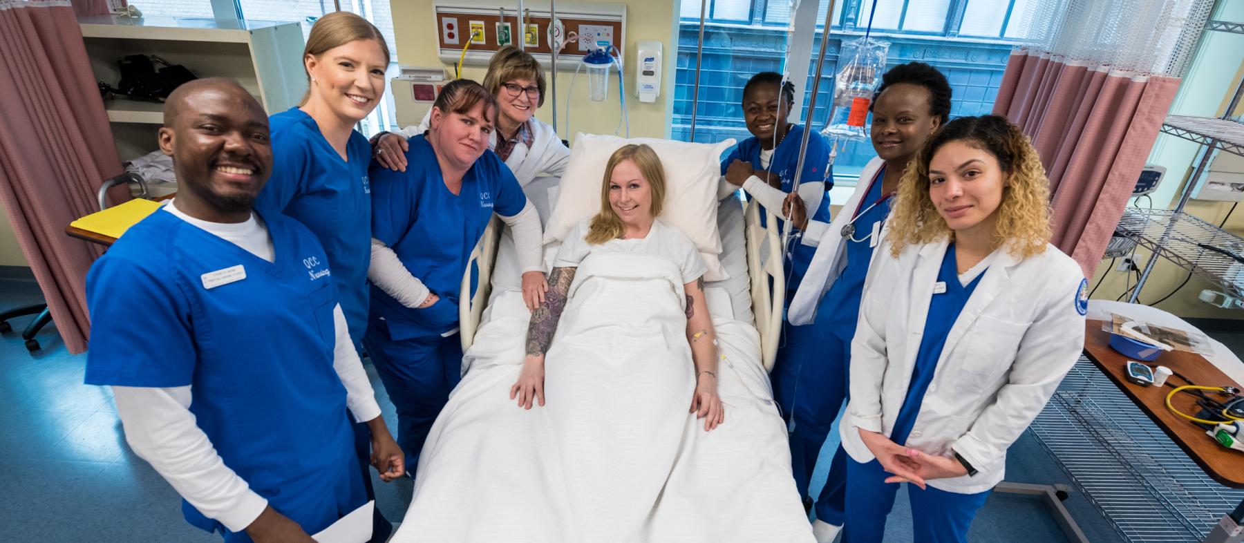 A group of nurses poses in a lab