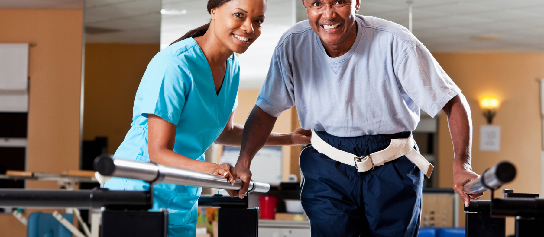 A therapist works with a man on a walking exercise