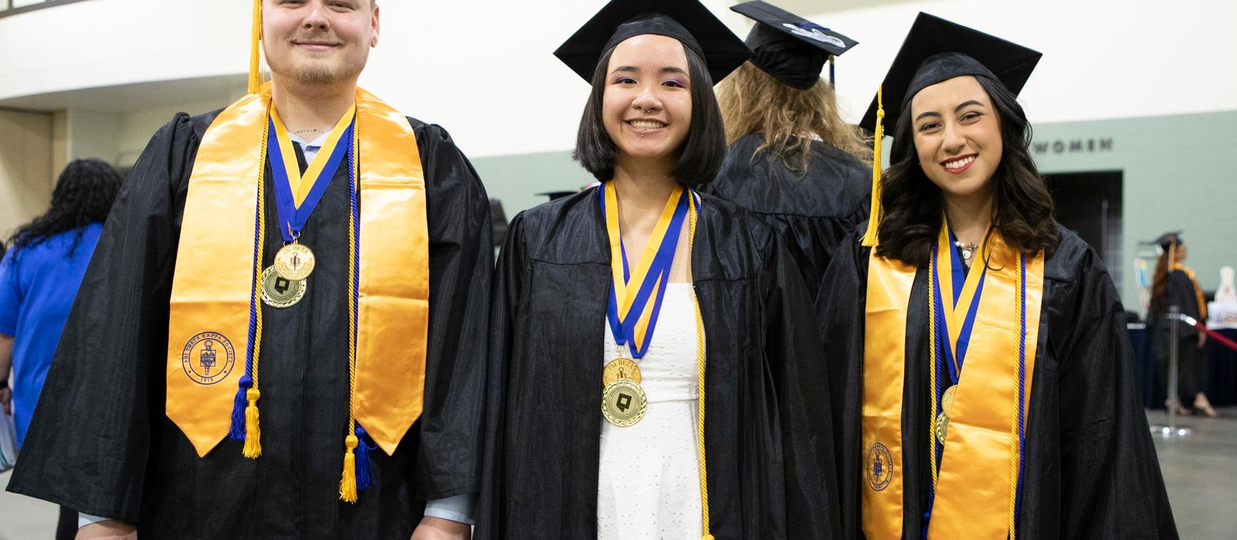 Psi Beta Graduates show off their regalia at QCC’s commencement at the DCu Center