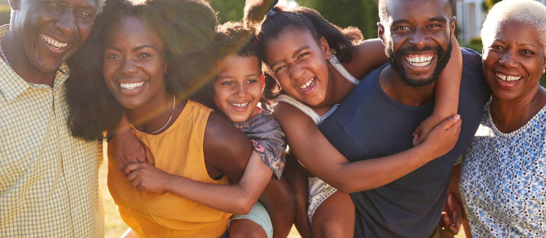 A family with children poses as a group