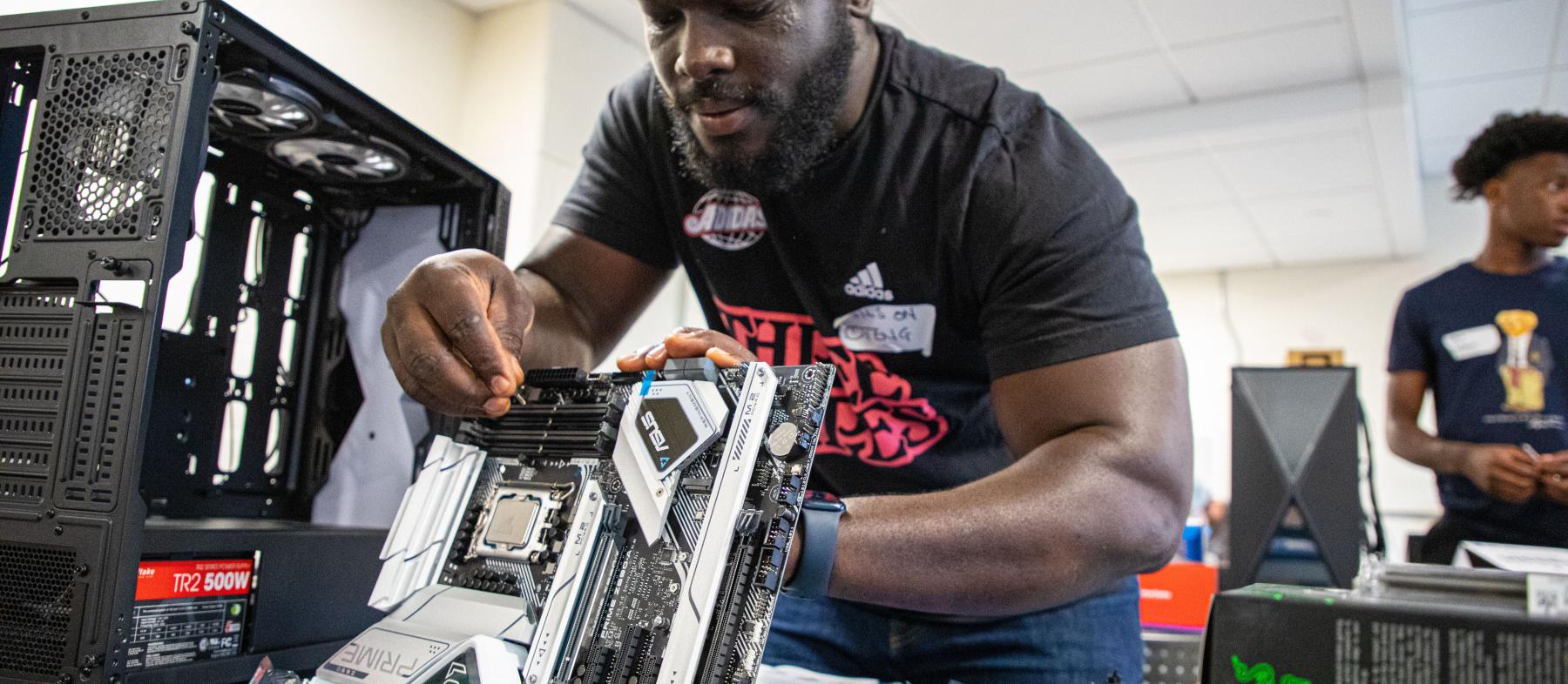 Students work on computers in a Build Your Own Computer STEM workshop