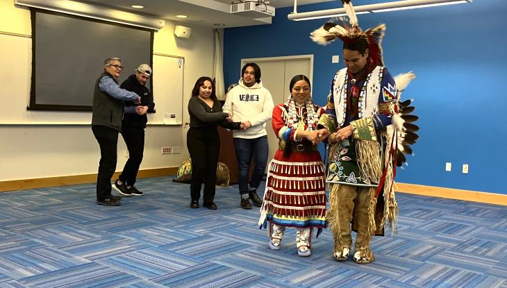 Presenters and audience members joined the alligator dance, a traditional couples dance.