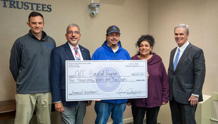 (from left) Assistant Director of Athletics & Fitness Center Josh Cole, QCC President Dr. Luis Pedraja, Men’s Head Baseball Coach Corey Coleman, Director of Athletics & Fitness Center Lisa Gurnick and Worcester County District Attorney Joe Early, Jr.