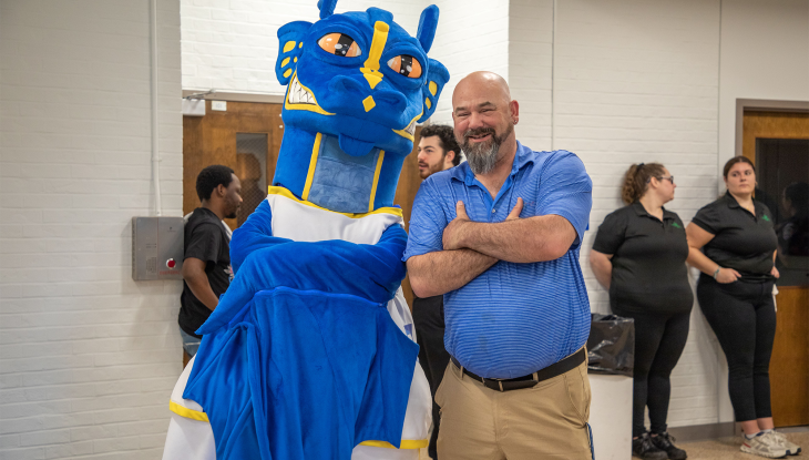 QCC student athlete Paul Landry hangs with the Wyvern at this year's athletic ceremony.