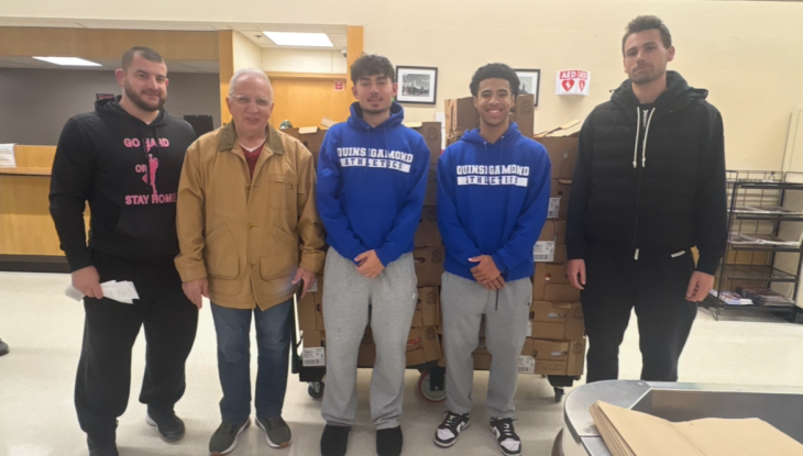 QCC Men's Basketball team pitched in to help feed families in Worcester.