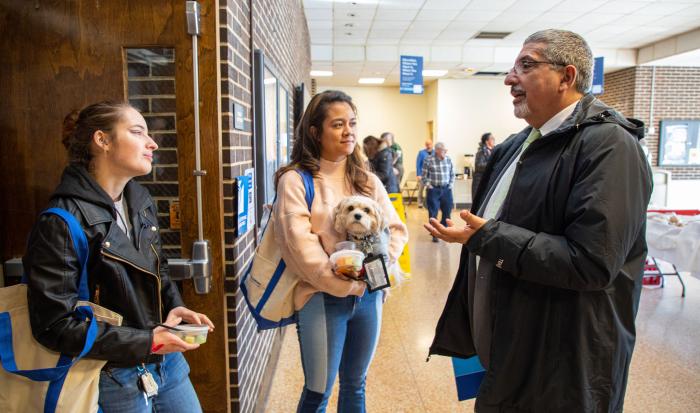 Dr. Pedraja speaks with student panelists Hannah Rosenkrantz and Doretta Stoler.