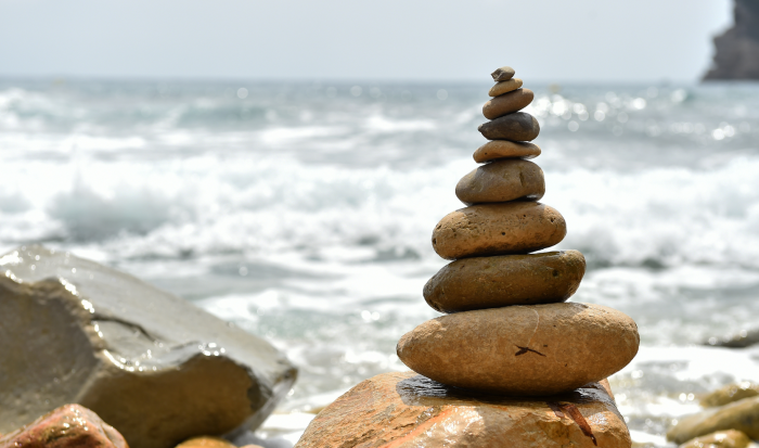 A pile of rocks on a sea shore A pile of rocks on a sea shore