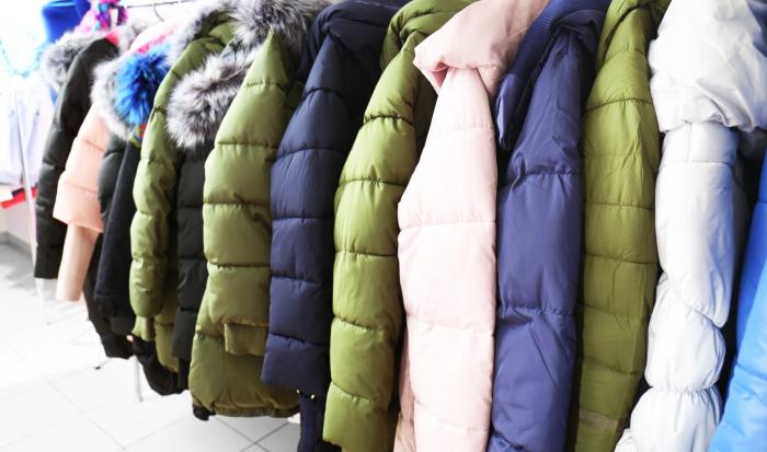 coats hanging on a rack coats hanging on a rack