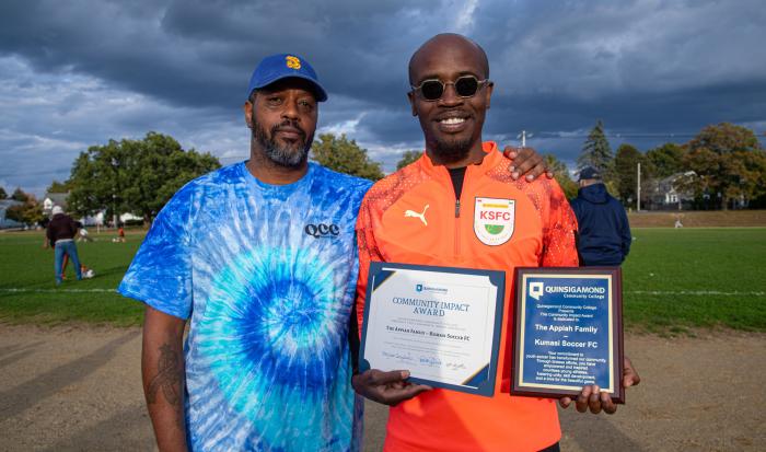QCC Director of Community Engagement Sean Harris (left) and Kwame Appiah of Kumasi FC Soccer Club QCC Director of Community Engagement Sean Harris (left) and Kwame Appiah of Kumasi FC Soccer Club