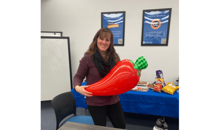 Coordinator of Career Services & Credit for Prior Learning Nichole Wheeler with her prize for winning a chili contest Coordinator of Career Services & Credit for Prior Learning Nichole Wheeler with her prize for winning a chili contest