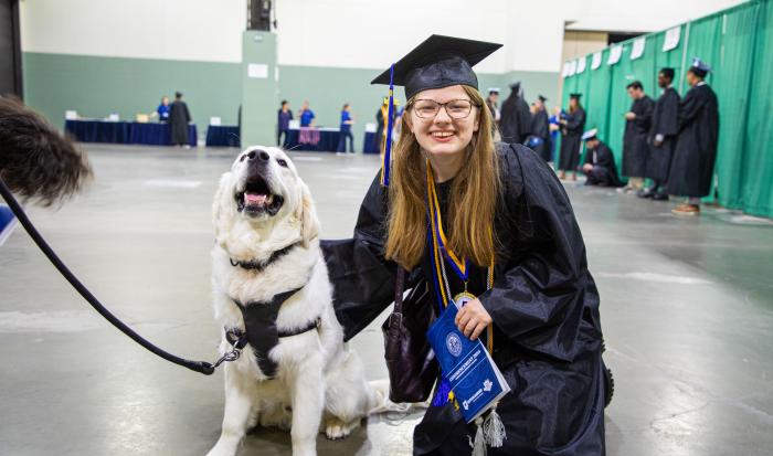 A graduate with Siggy, QCC's campus resource officer A graduate with Siggy, QCC's campus resource officer