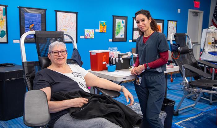 Assistant Director of Operations for External Affairs Shirley Dempsey (left) donating blood. Assistant Director of Operations for External Affairs Shirley Dempsey (left) donating blood.