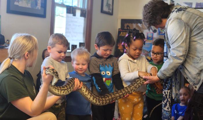 Students get to hold a carpet python. Students get to hold a carpet python.