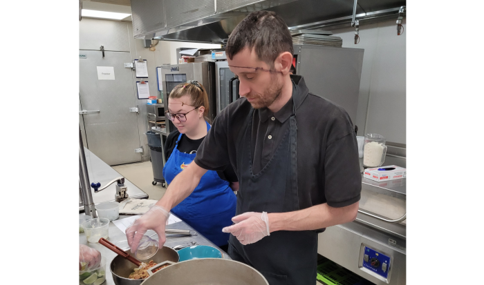 Ariel Norum (left) and Jeffrey Card work on Chipotle Chicken Rice Bowls Ariel Norum (left) and Jeffrey Card work on Chipotle Chicken Rice Bowls