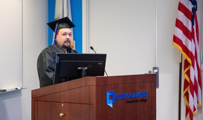 Graduate Michael Johnson speaks at the HSE/GED graduation ceremony. Graduate Michael Johnson speaks at the HSE/GED graduation ceremony.